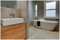 Very high quality contemporary bathroom with oak wood bathroom vanity.
